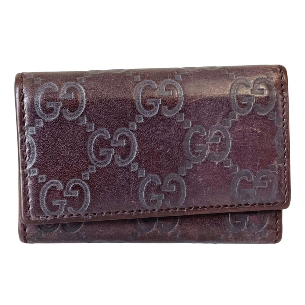 Gucci brown monogram embossed leather key case